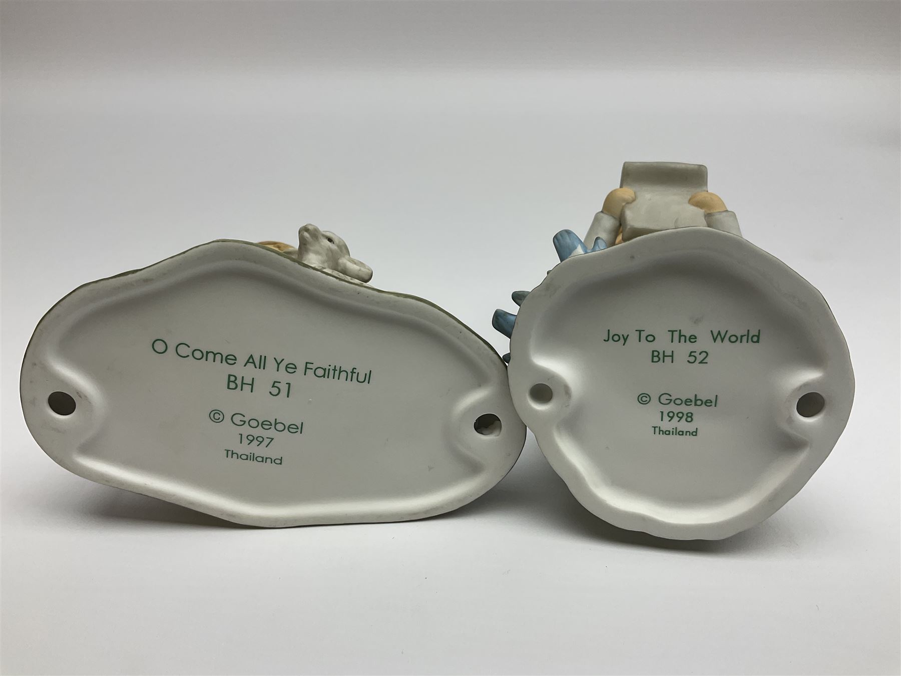 Eight Christmas Hummel figures by Goebel, to include Wintertime Chapel candle holder, Winter Fun, Christmas Morning, Christmas Time and Gingerbread Lane, tallest H21cm