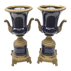 Pair of 19th century style cobalt blue twin-handled Campana urns, with bronzed mounts, raised upon four scroll supports, H51cm, W27cm 