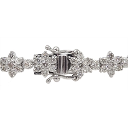  White gold flower design line bracelet, stamped 18K, total diamond weight 5.20 carat  