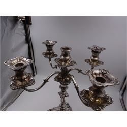 Modern silver five branch candelabra centrepiece, the four extending branches each with removable sconces, surrounding a central candle holder, upon a knopped stem and weighted stepped square foot, with anthemion to each corner, hallmarked Roberts & Belk, Sheffield 1984, H36cm 
