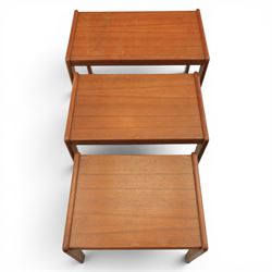A pair of Nathan 'Highback Carvers' and a 20th century nest of teak tables, (Tables W65cm, D38cm, H49cm)
(Carvers W57, H97)