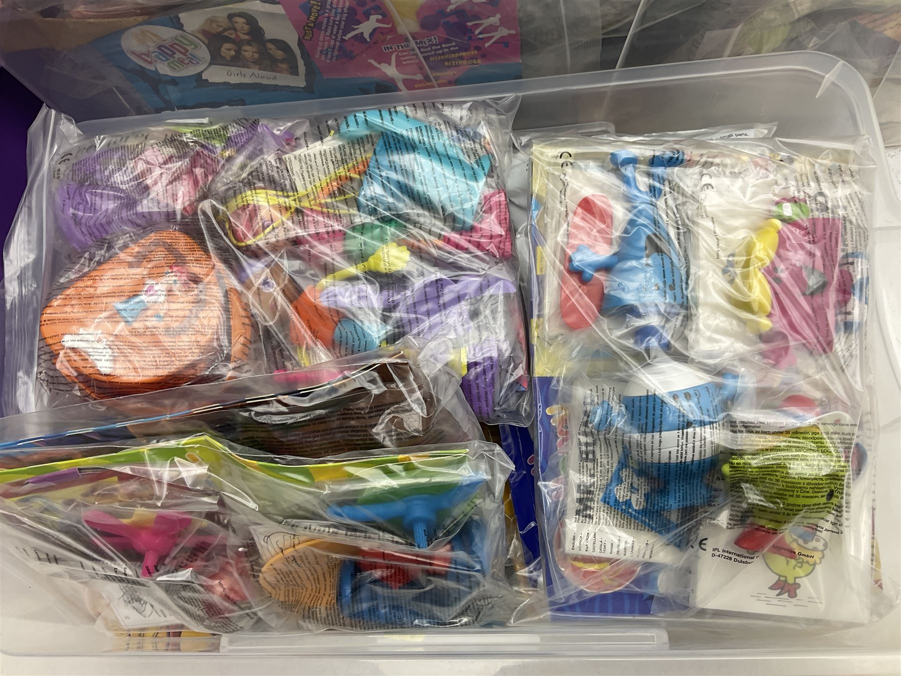 Large quantity of Mcdonalds toys to include Herbie and Polly Pocket in three boxes