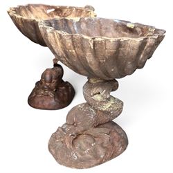 Large assorted collection of glazed stoneware jars and planters, with two lidded crocks, a brass urn and three decorative garden planters, including a pair of shell-form examples