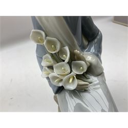 Four Lladro figures, comprising Afternoon Promenade no 7636, Nostalgia no 5071, both with original boxes, Girl with Lilies no 4972 and Madonna no 4534, largest example H27cm