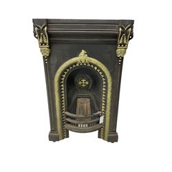 Cast iron fire place, ornate moulded arch and corbels, black and gilt finish