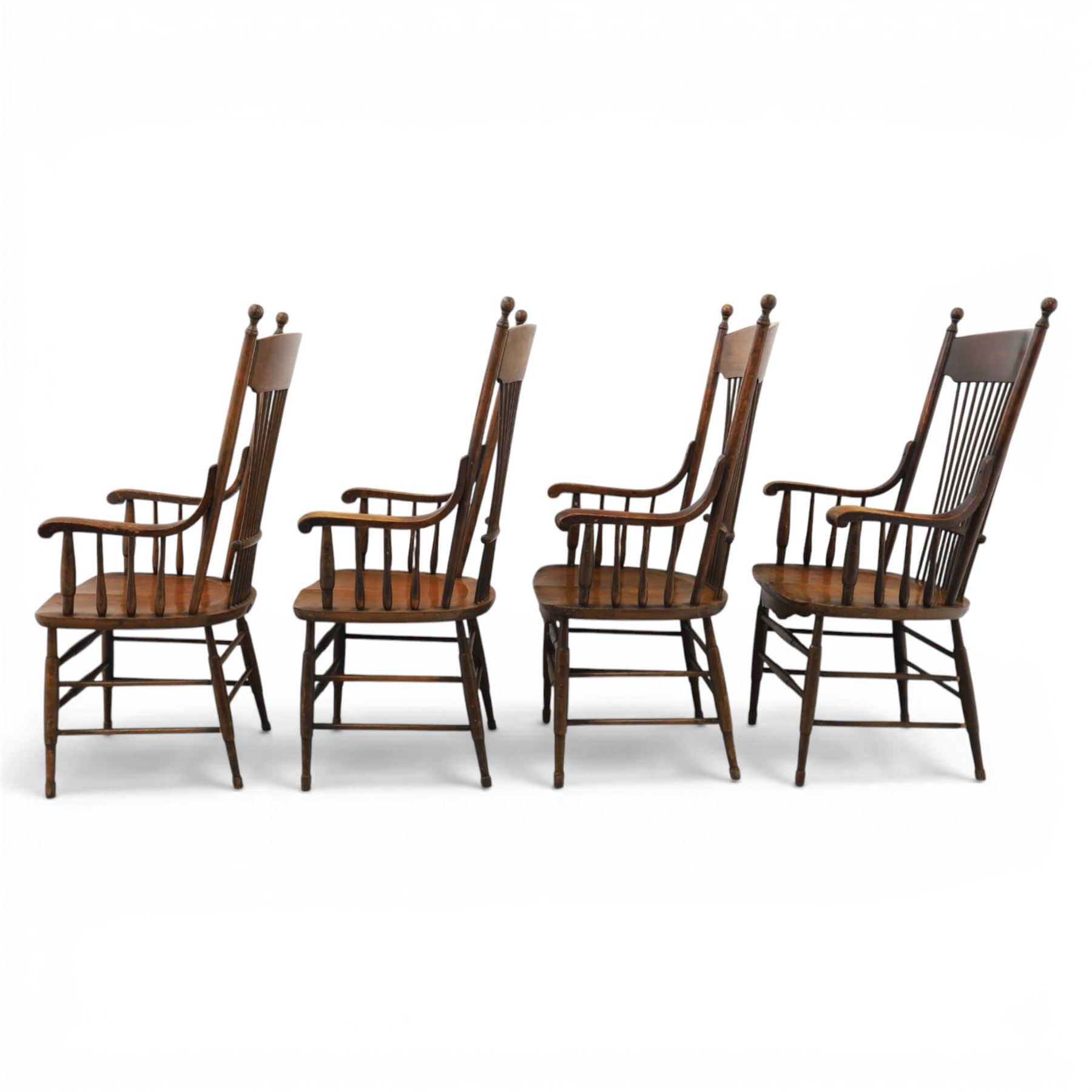 Set of eight 19th century ash and elm spindle back Windsor armchairs, arched top rails above fan-shaped spindle backs, curved arms with turned supports, shaped saddle seats, on turned legs joined by H-stretchers