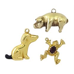 Three 9ct gold pendant/charms including pig, sitting dog and paste stone set frog