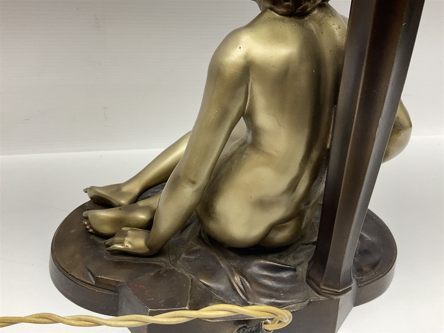 Art Deco style bronzed and gilded spelter figural table lamp with green Uranium glass shade; H48cm, another table lamp; and a bisque group