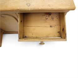 Victorian stripped pine sideboard, rectangular plank top rounded edges, with central cupboard door with shaped panel, flanked by two banks of three graduating drawers with turned knobs, raised on a plinth base 