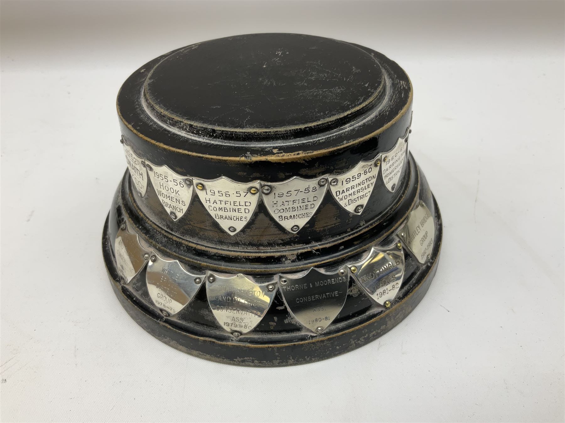 Group of silver, to include filled figure of a pheasant, hallmarked for London, pair of silver mounted horn napkin rings, miniature Edwardian bible with silver cover embossed with putti, Victorian silver brooch, ebonised plinth with applied inscribed silver shields, etc., together with two stick pins, one example with 9ct gold terminal 