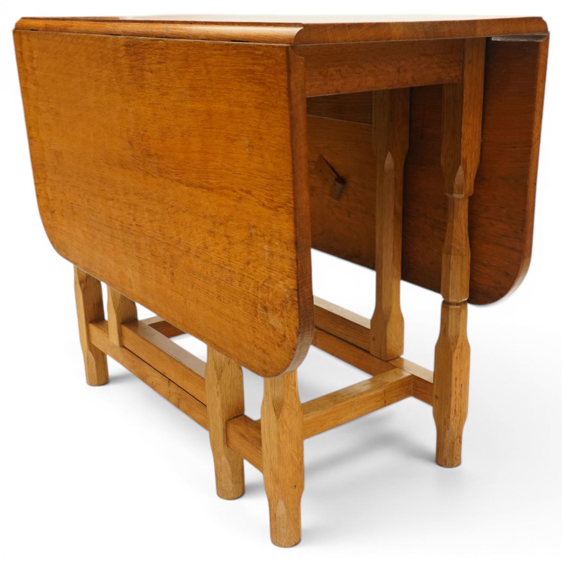 Beaverman - 1980s adzed oak drop-leaf dining table with gate-leg action, adzed top and leaves extending to 129cm, octagonal supports with large Beaver carving, by Colin Almack of Sutton near Thirsk 