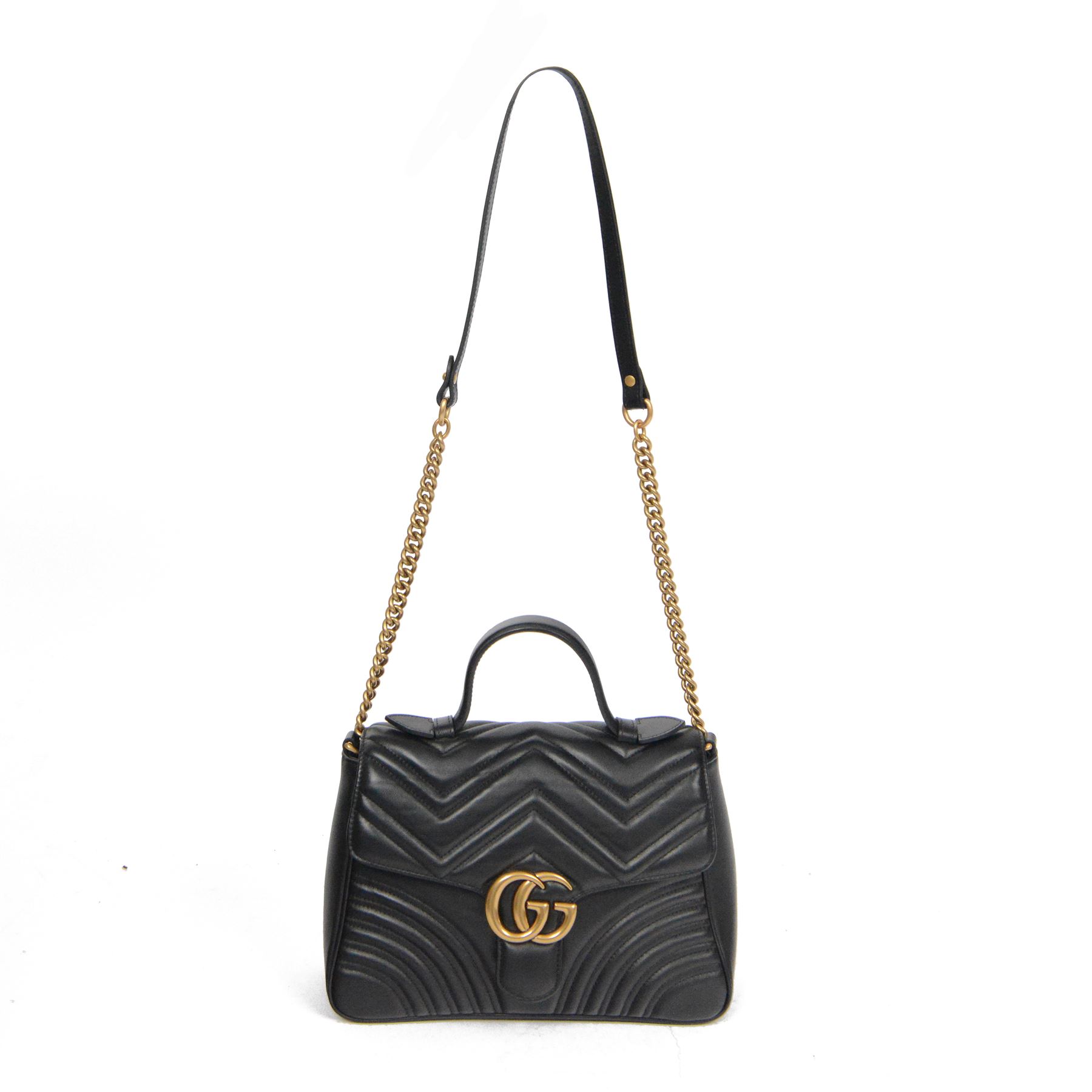 Gucci GG Marmont black matelassé leather top handle bag, made in Italy, with chevron quilted leather and heart motif to the reverse, antique gold-tone Double G front hardware, leather top handle and detachable chain shoulder strap with leather shoulder guard, front flap closure, suede-effect interior with zip pocket and leather logo tab stamped Gucci made in Italy, together with original Gucci dust bag and carrier, W27cm D11cm H20cm