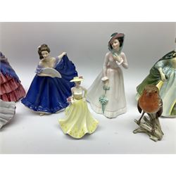 Royal doulton figures, comprising of, a victorian lady HN728, Premiere HN2343, Julia HN2706, Elaine HN4718, together with two coalport figures Kerry and beau monde Harriet and a Goebel robin