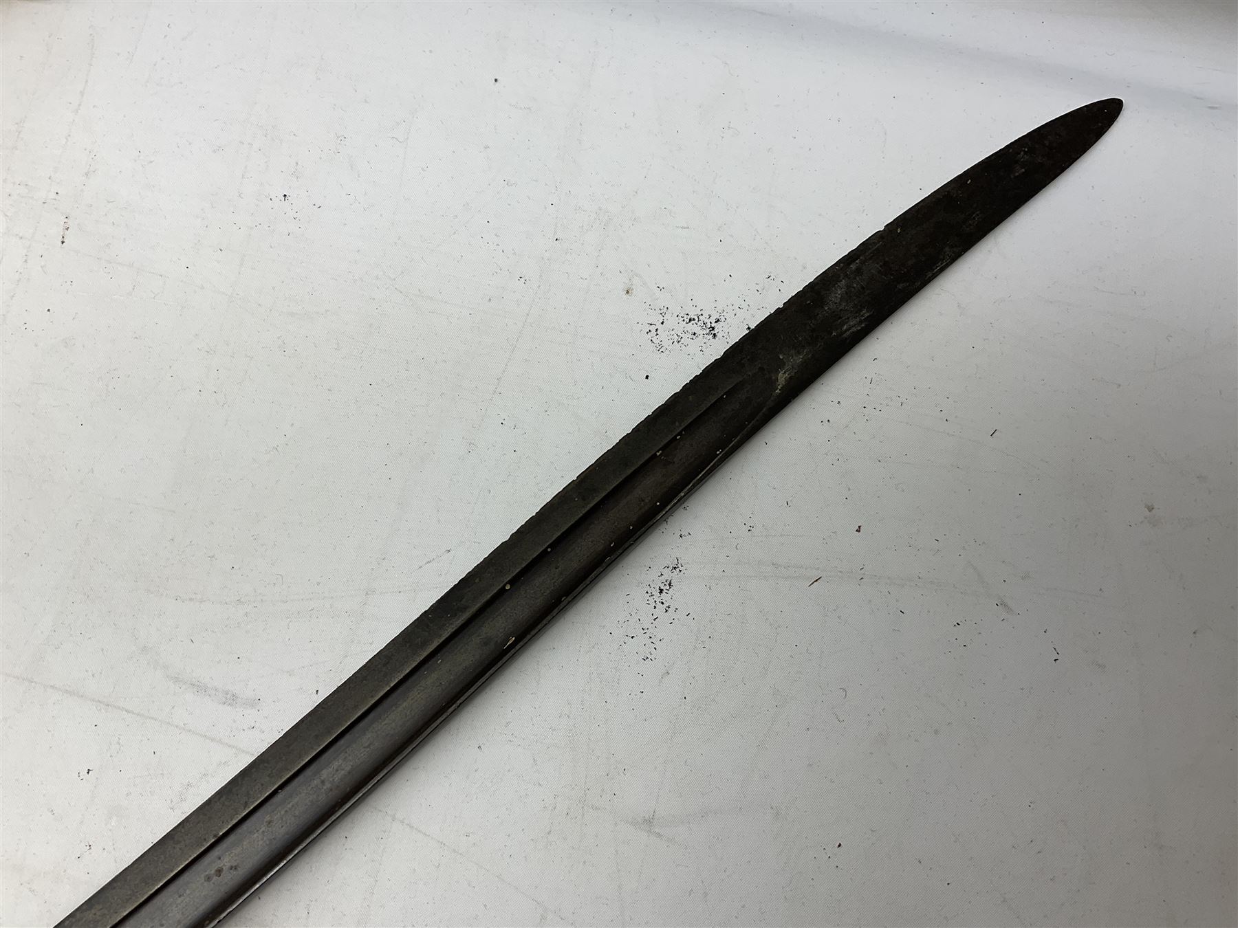 French Model 1866 sabre bayonet with 57cm fullered steel curving blade; in steel scabbard L71cm overall; another Model 1866 sabre bayonet lacking scabbard; and British Pattern 1856 sword bayonet (no scabbard) (3)