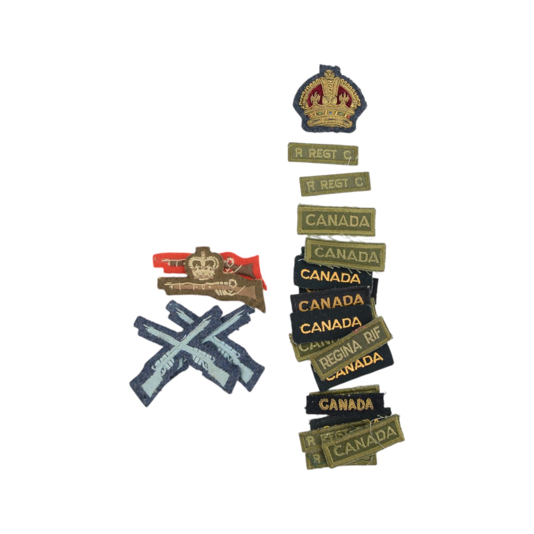 Large collection of militaria items, including RAF dog tags, The Royal Grenadiers belt buckle, Royal Regiment of Canada swagger stick, insignias including marksman badge etc