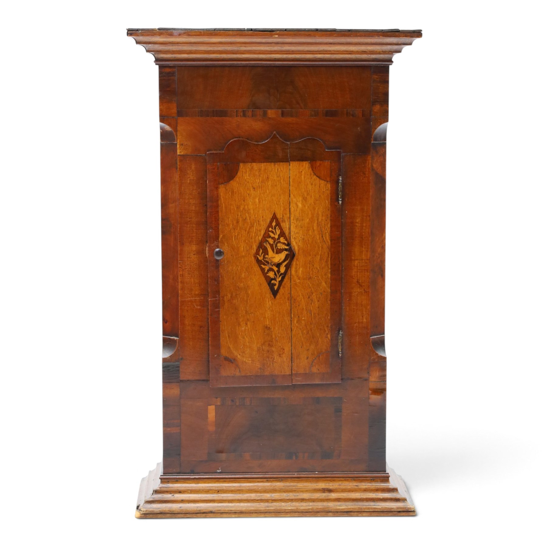 19th century clock trunk cupboard, veneered front with cantered corners, stepped plinth base