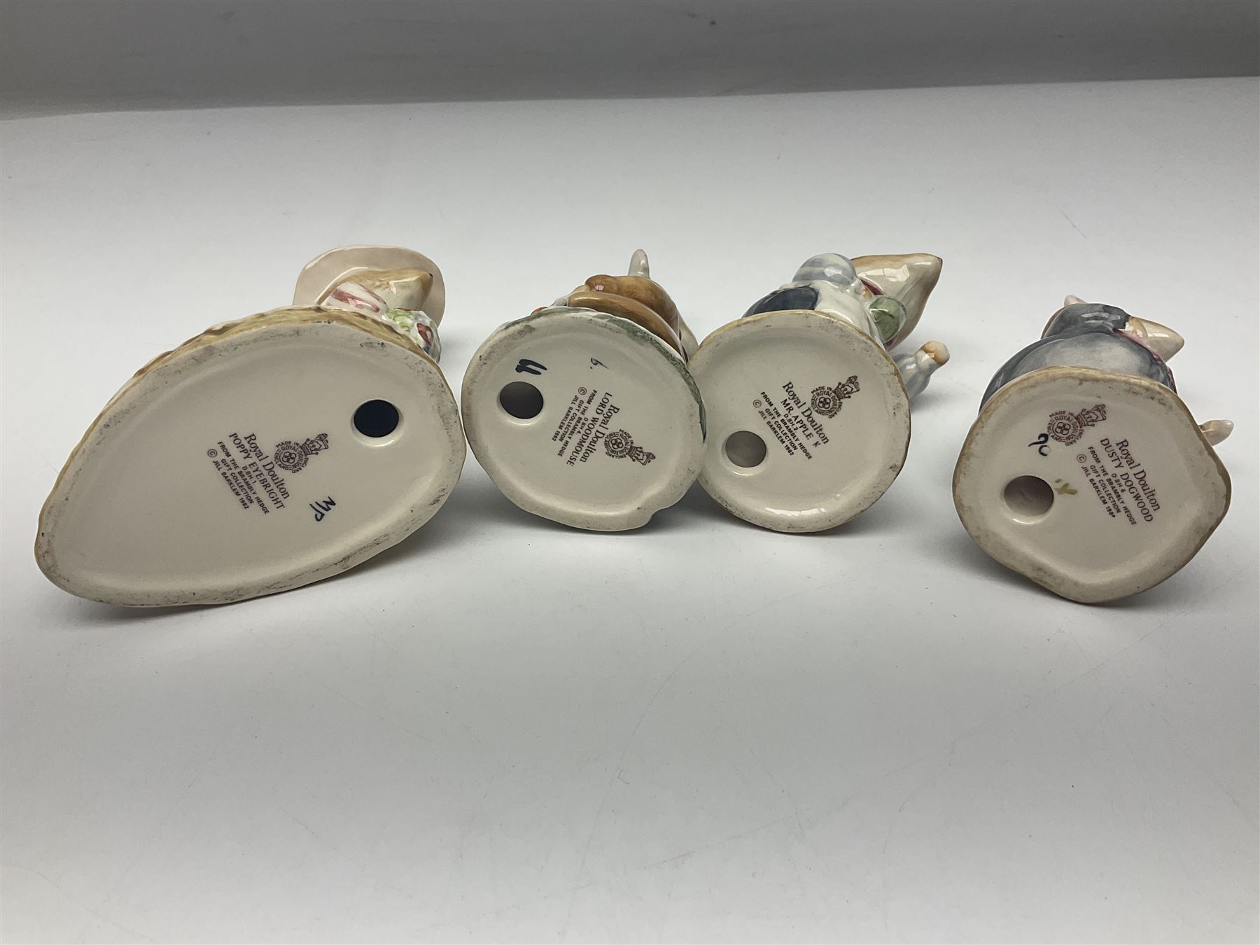 Five Royal Doulton Beatrix Potter figures, comprising Poppy Eyebright, Clover, Lord Woodmouse, Mr Apple and Dusty Dogwood, together with Beswick Appley Dapply figure and three Crummles Beatrix Potter enamel pill boxes