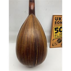 W.D. Keech banjolele pat.219720/23 with etched signature to the back; serial no.A12082 L55cm; and a restored Italian mandolin with segmented lute back; together with three music books