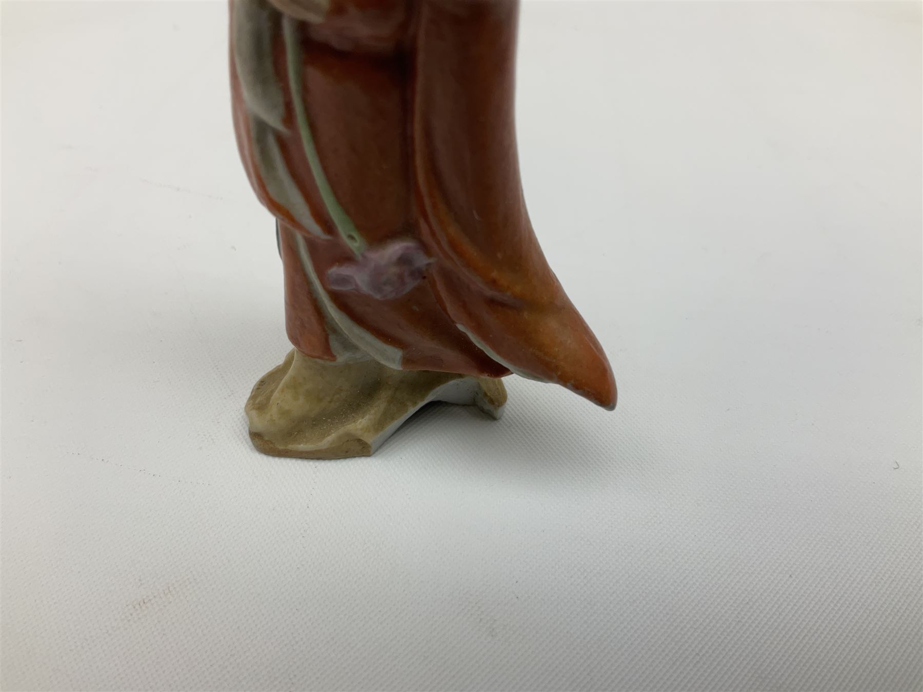 Japanese parquetry puzzle box L12cm; another Japanese puzzle box with marquetry top of Mount Fuji; eleven graduated Chinese figures including immortals; and Chinese figure of a lady standing on a hardwood base next to a horn table (14)