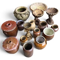 Large assorted collection of glazed stoneware jars and planters, with two lidded crocks, a brass urn and three decorative garden planters, including a pair of shell-form examples