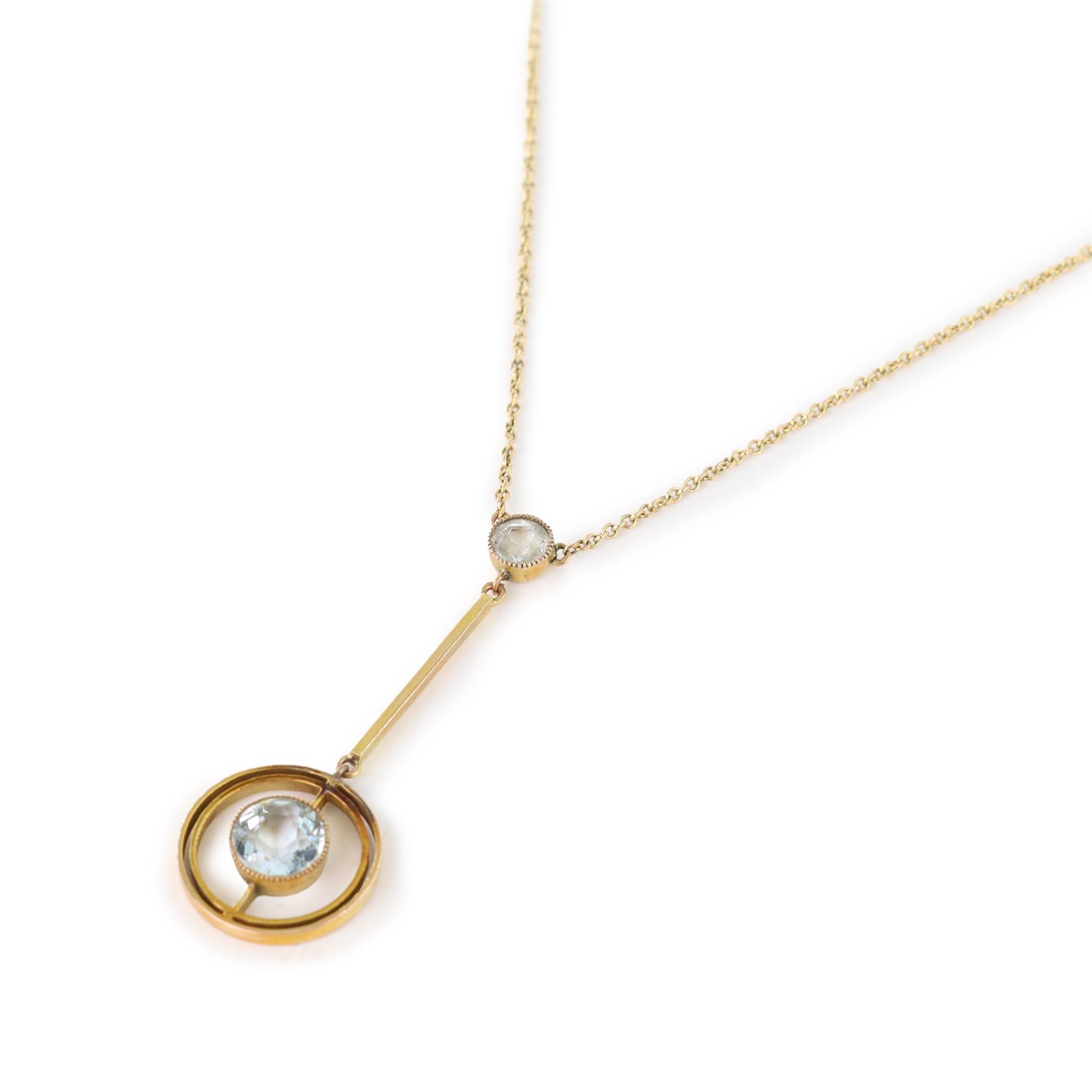 Early 20th century gold aquamarine pendant necklace, milgrain set round cut aquamarine within a pierced circular setting, to a smaller round cut aquamarine, on a fine trace link chain necklace, stamped 9ct, in a velvet and silk lined box by Leefe & Sons, Malton