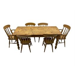 Pine farmhouse dining table, rectangular top with rounded corners, raised on turned supports; together with a set of six (4+2) spindle-back dining chairs