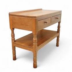 Mouseman - oak side table or buffet, raised back over rectangular canted adzed top, fitted with two drawers, raised on four octagonal turned supports united by undertier, carved with mouse signature, by the workshop of Robert Thompson, Kilburn 