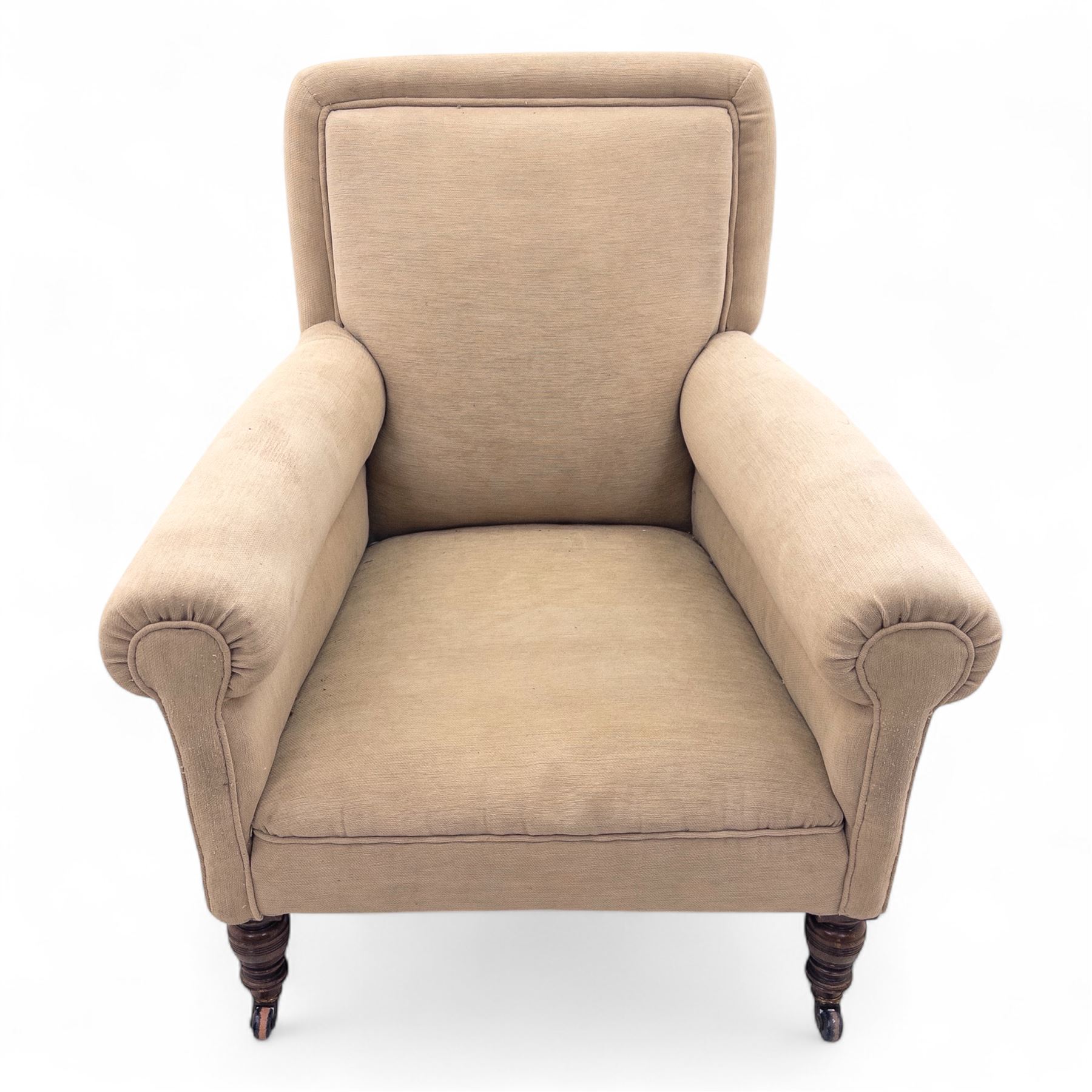 Late 19th century Howard style upholstered armchair, with deep seat and scroll arms, on turned front legs with brass and ceramic castors, the rear leg stamped Smith & Co Bristol No.302 