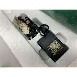 Six Disney Winnie the Pooh Christmas snow globes, comprising large Mr Christmas Holiday Snowfall, An Enchanted Christmas, It's A Small World Christmas 1994,  Tree Trimming, 1995 Christmas At Our House and Christmas Band Concert, together with Mr Christmas Holiday Go Round, all with boxes (7)