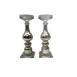 Pair of glass candlesticks with shaped columns decorated with internal silver flaked silver design, H37cm
