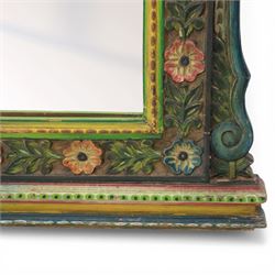 Late 20th century Venetian style polychrome carved wall mirror, arched cresting with central shell motif and scrolling foliate decoration, moulded frame with carved floral borders in relief, enclosing rectangular mirror plate, shaped sides with scroll terminals