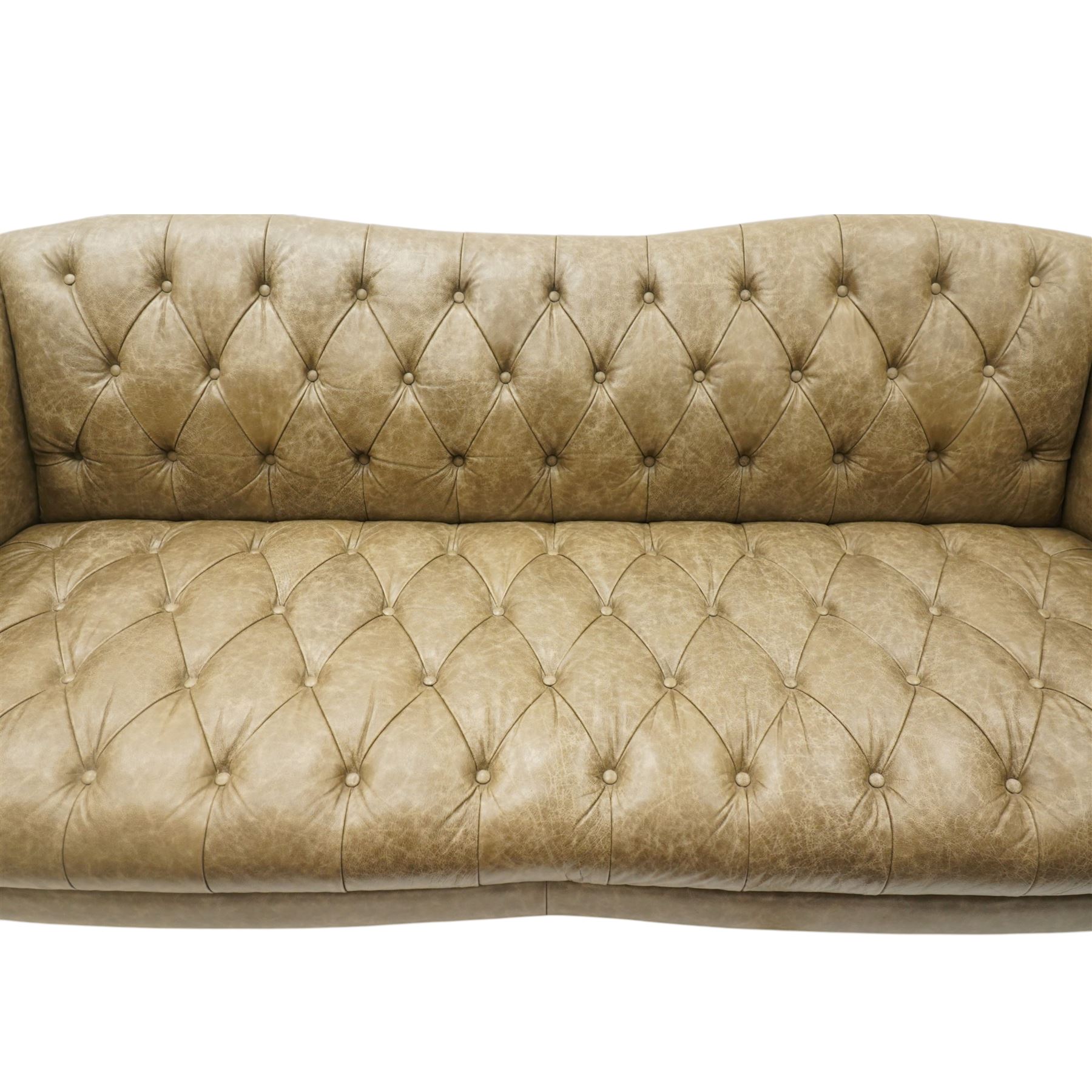Tetrad - 'Matisse' grande three-seat sofa, Chesterfield shape with rolled arms flanking a serpentine back and front, upholstered in buttoned tan leather with close-nailed studwork, on turned feet