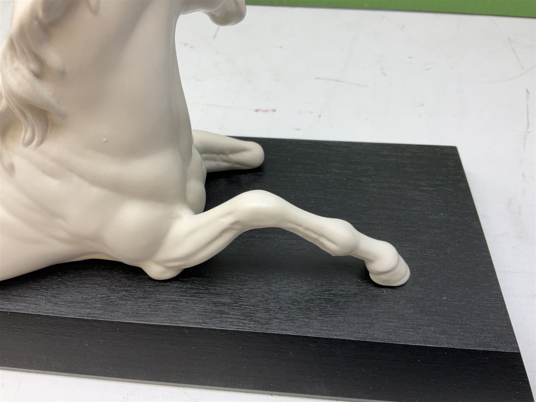 Five Beswick and Royal Doulton horse figures in matt white on black plinths, comprising of  Spirit of Affection no. 2689/2536, Springtime no.2837, Spirit of peace no.2916, Spirit of earth no.2914 and Spirit of the wild no. 183, together with a composite figure of a horse (6)