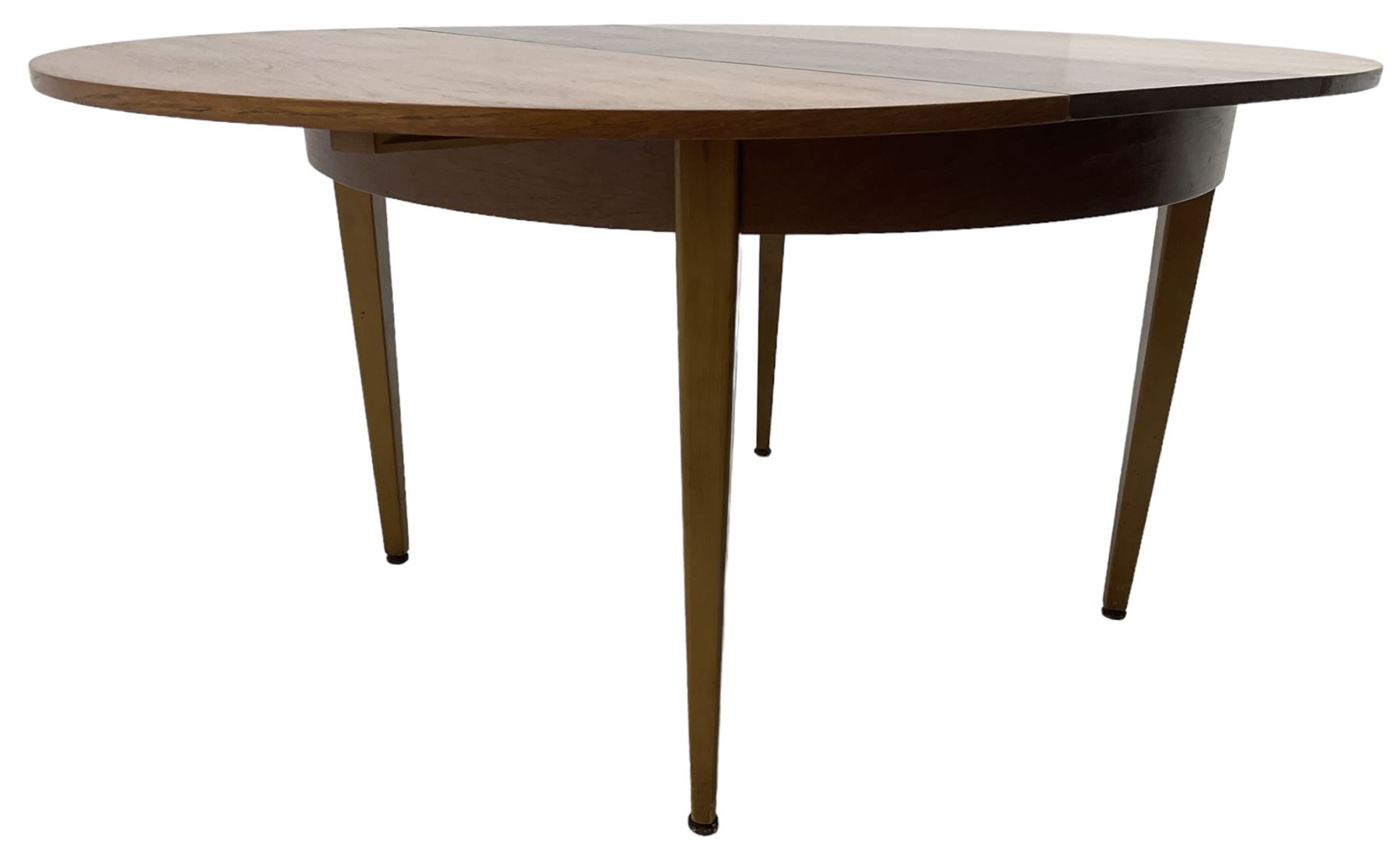 G-Plan - mid-20th century teak extending circular dining table, with concealed additional leaf (W114cm, H72cm); and a set of four mid-20th century teak dining chairs, seat upholstered in beige fabric
