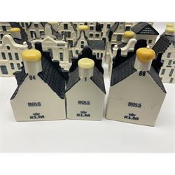 Twenty seven KLM Bols Blue Delft's decanters in the form of Dutch houses, some with contents