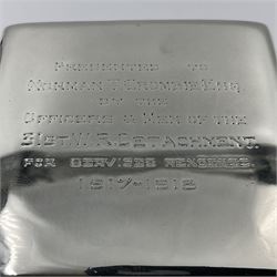 Edwardian silver mounted playing card case, hallmarked William Harrison Walter, Birmingham 1903, the sides each with a period playing card set behind a bevelled glass panel, the hinged cover with later engraving 'Presented to Norman T Crombie Esq by the officers & men of the 31st WR Detachment for services rendered 1917-1918', with red leather lined interior, the three compartments upon a sprung base and containing two later wooden Whist markers, case H12.5cm