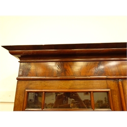  Victorian figured mahogany bookcase on cupboard, projecting cornice, two astragal glazed doors enclosing four adjustable shelves, above single moulded frieze drawer, two cupboard doors, plinth base, W134cm, H230cm, D50cm  