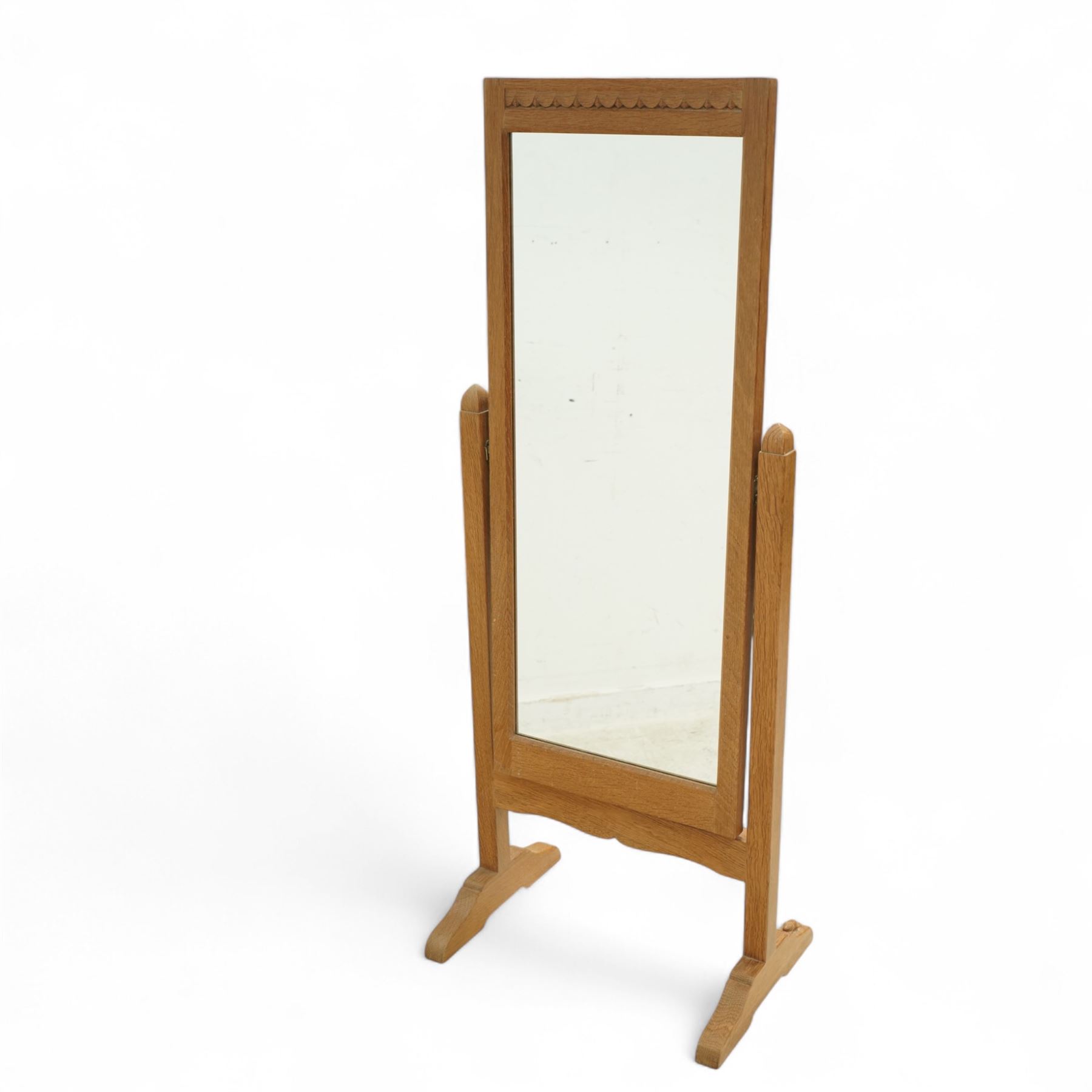 Beaverman - Yorkshire oak cheval dressing mirror, rectangular frame on shaped uprights with sleigh supports, carved with signature beaver to foot, by the workshop of Colin Almack, of Sutton near Thirsk