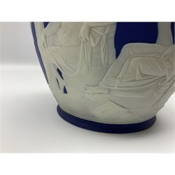 19th century Wedgwood dark blue dipped Jasperware Portland vase, of ovoid form with twin handles to shoulders and waisted neck, and flared rim, the body decorated with a continuous scene of classical figures in relief, the base decorated with portrait in relief, H26cm