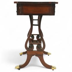 Early 19th century Regency burr elm work table, rosewood crossbanded top with notched corners above shaped end supports united by a turned stretcher, on brass paw feet and castors, stamped W Mason on lower turning