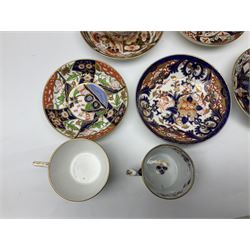 Early 19th century and later, eleven Royal Crown derby teacups and saucers in various patterns, to include Imari, Garden platter, and others, all with printed or painted marks beneath