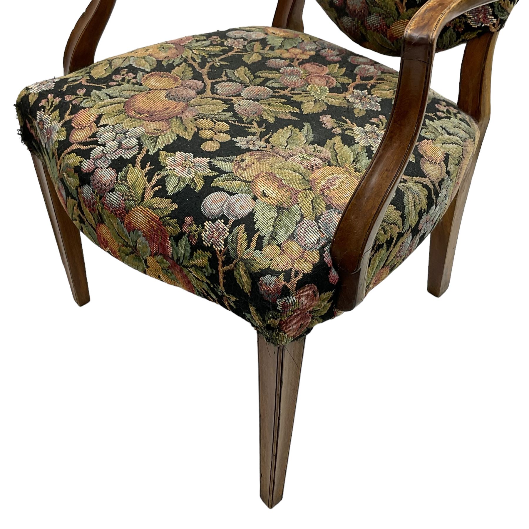 Pair of George III mahogany framed open armchairs, oval back and serpentine seat upholstered in fruit and foliage patterned fabric, shaped and moulded arms and arm supports, on square tapering moulded front supports 
