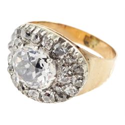 George III gold and silver old cut diamond cluster ring, the principal diamond of approx 0.75 carat, with pave set old cut diamond surround

