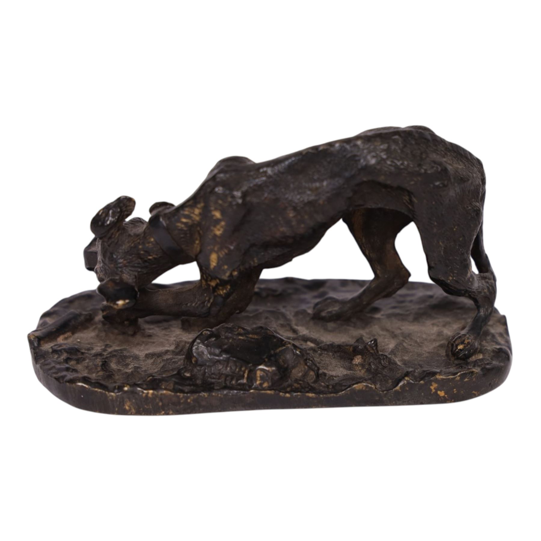 After R J Mene, bronze modelled as a dog with a bone, H5cm, L10cm 
