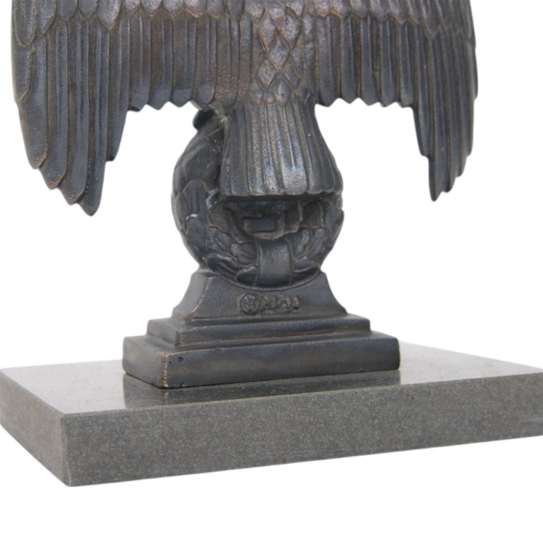 Composite cast bust of Hitler, together Third Reich Nazi German style desk stand depicting the national eagle and swastika on a black stone base, together with two other figures, bust H17cm 