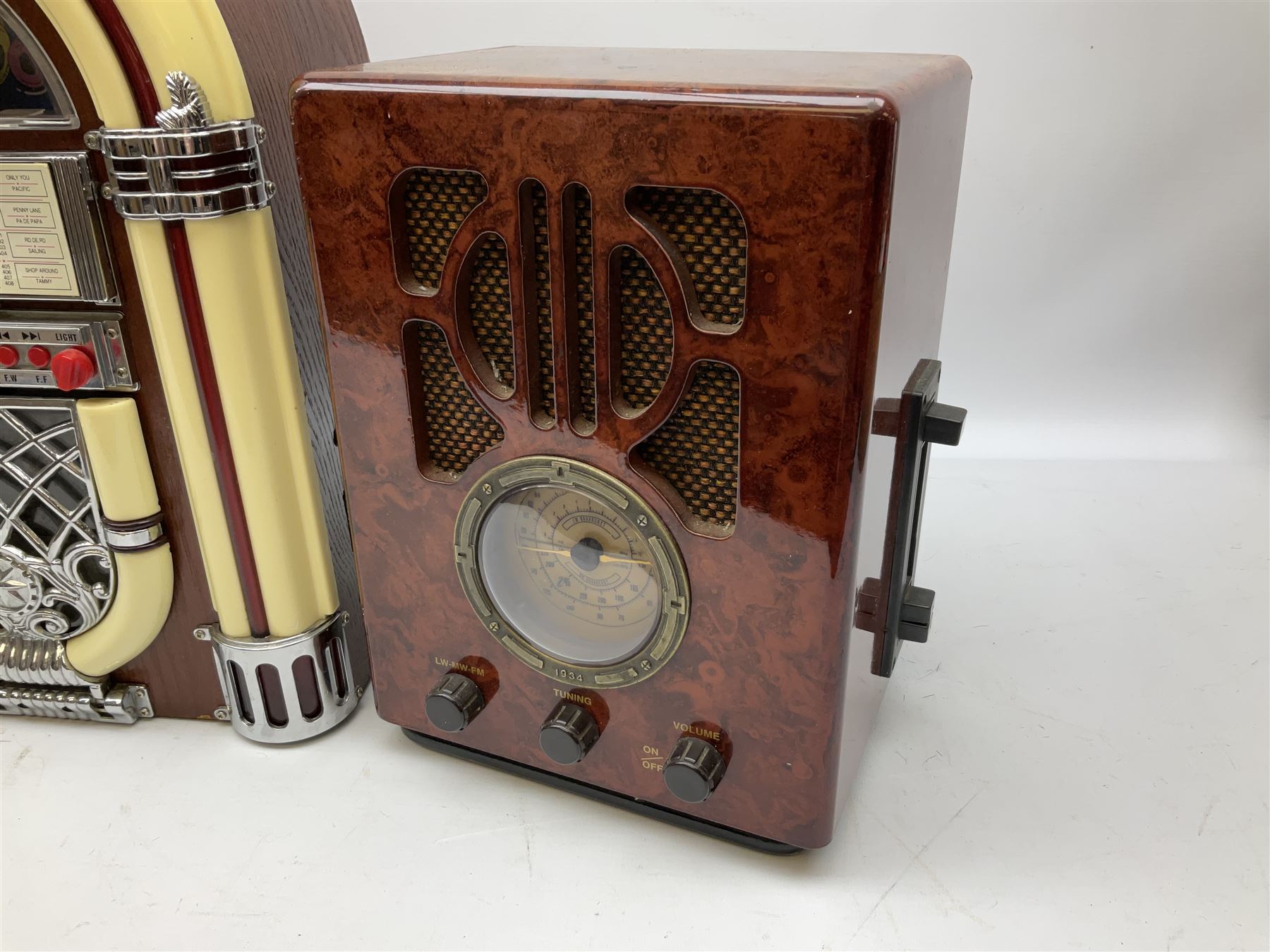 CD player in the form of a juke box, together with a Ferguson stereo and a vintage style radio