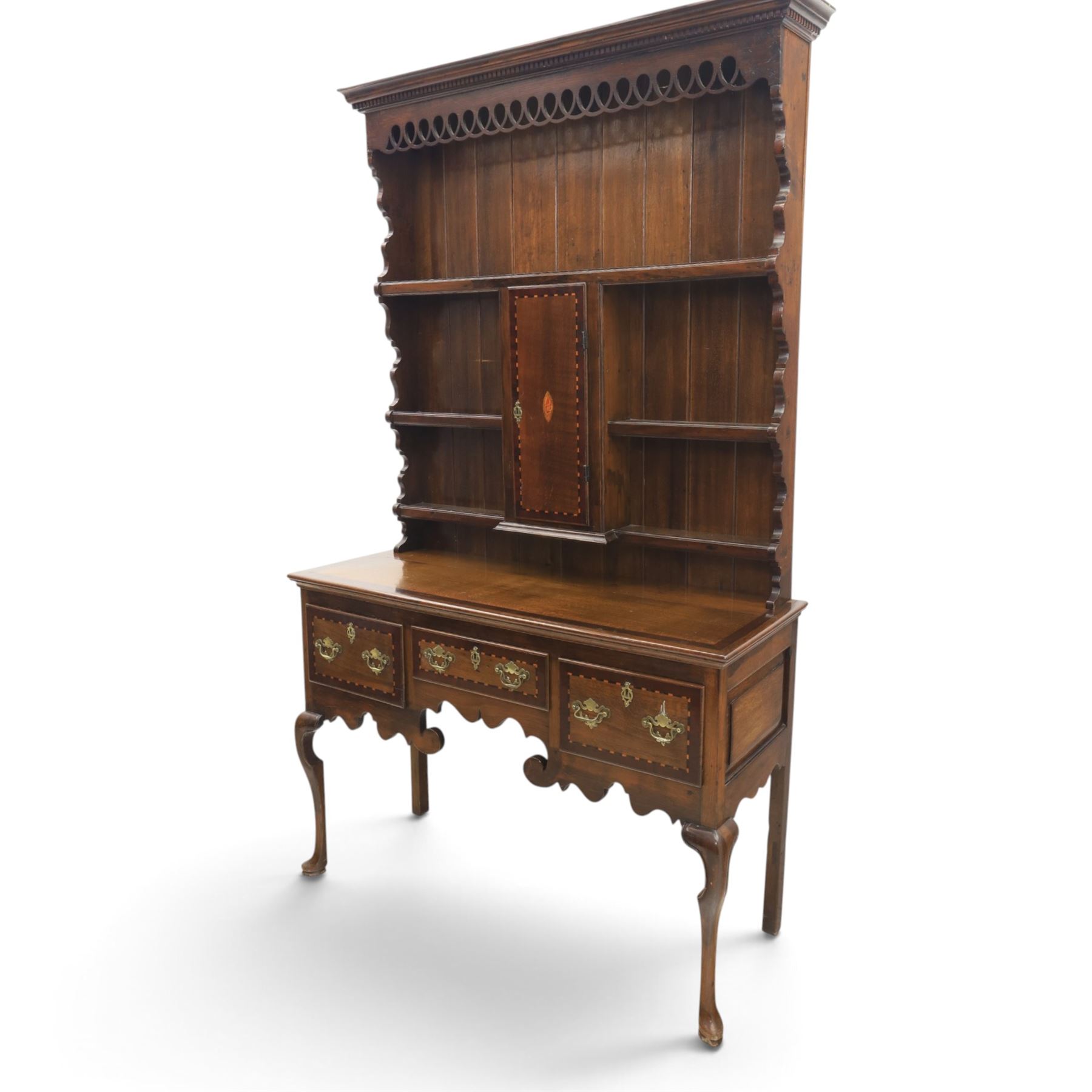 Late 19th century inlaid oak dresser and plate rack, plate rack with projecting cornice and fretwork, with three shaped shelves for plates, central cupboard with inlaid shell and border, brass escutcheon and key, the lower section with crossabanded top, above three drawers with brass handles and inlaid border, shaped apron raised on cabriole supports 