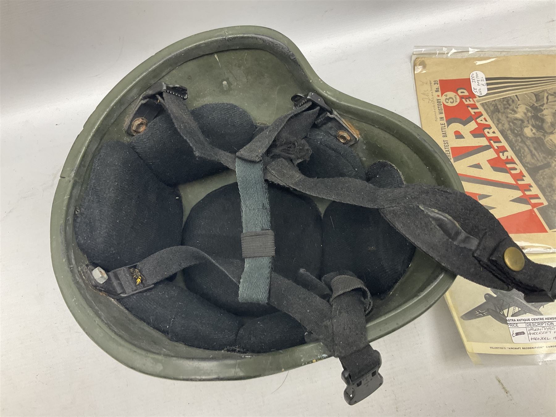 Bakelite cased Megger Insulation tester, by Evershed and Vignoles Ltd, Acton Lane Works, Chiswick, London W4, RW Munro Ltd air speed knots gauge, American green army helmet, The War Illustrated, WW2 aircraft photographic postcards, etc