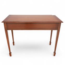 Edwardian design mahogany desk, crossbanded rectangular top above twin drawers with brass handles, raised on square tapering legs terminating in spade feet