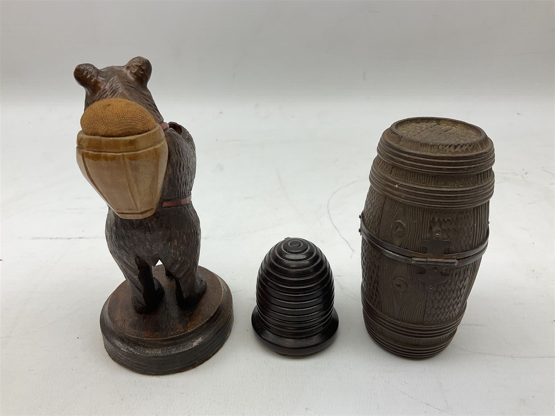 19th century wooden beehive thimble holder with silver bee decoration, black forest style pin cushion and thimble holder, modelled in the form of a standing bear and a wooden cased sewing set with silver thimble, sewing set H10cm